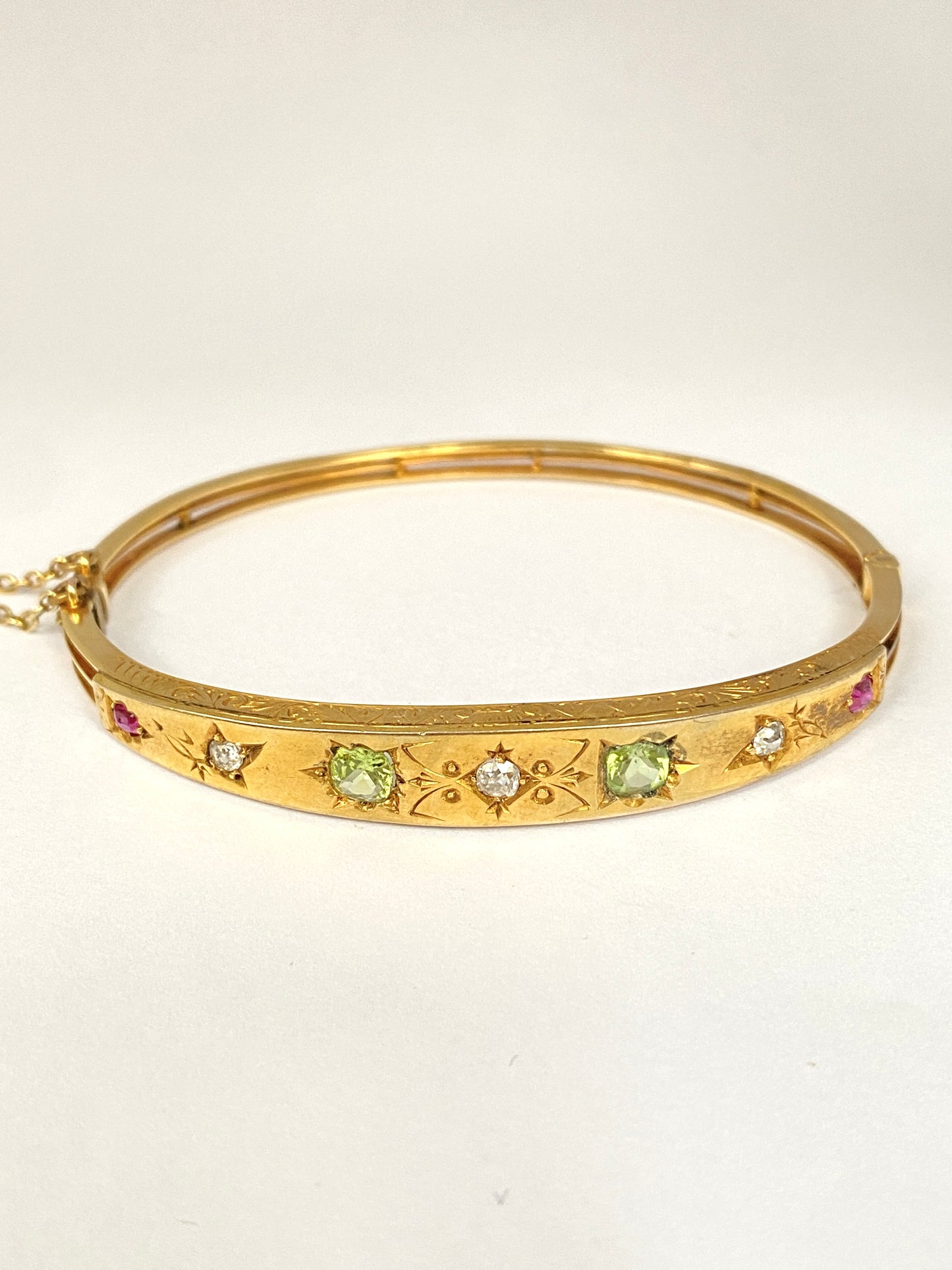 Antique, 9ct Gold, Diamond, Peridot and Ruby Starburst Bangle. 9.08g