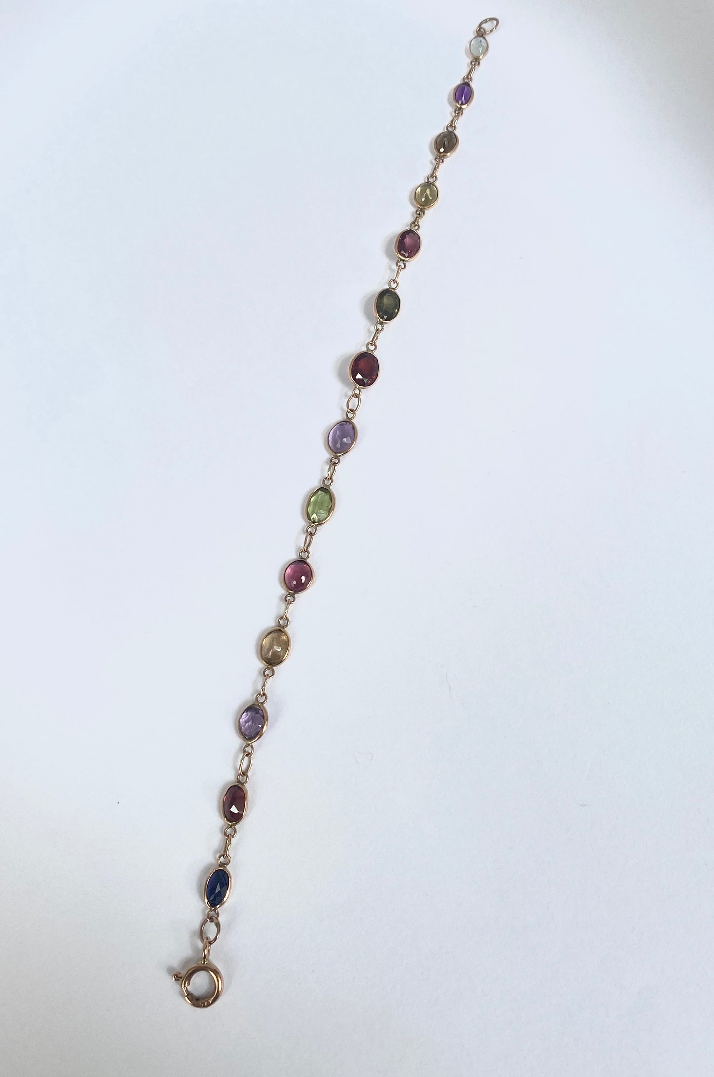 Vintage, 9ct Gold, Multi Gem Bracelet featuring, Peridot, Garnet, Amethyst, and Zircon