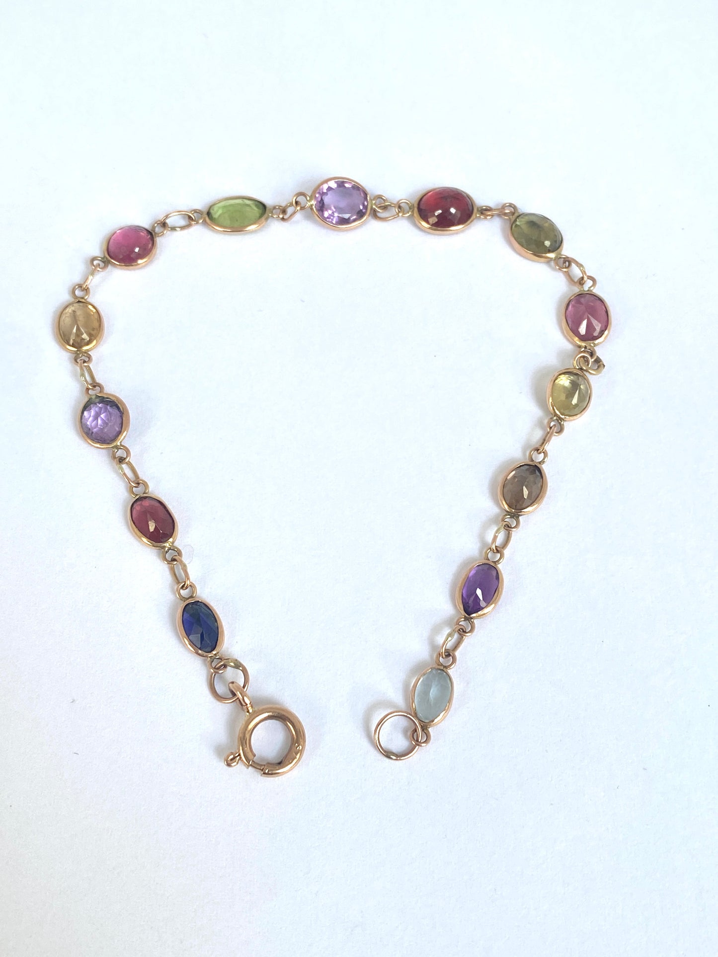 Vintage, 9ct Gold, Multi Gem Bracelet featuring, Peridot, Garnet, Amethyst, and Zircon