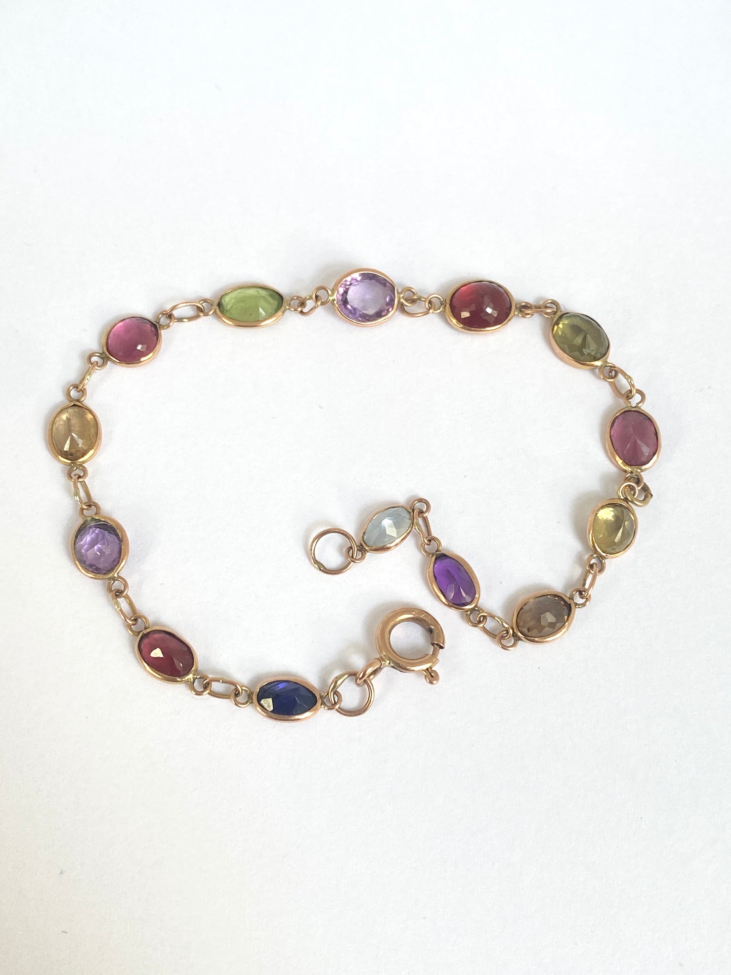 Vintage, 9ct Gold, Multi Gem Bracelet featuring, Peridot, Garnet, Amethyst, and Zircon