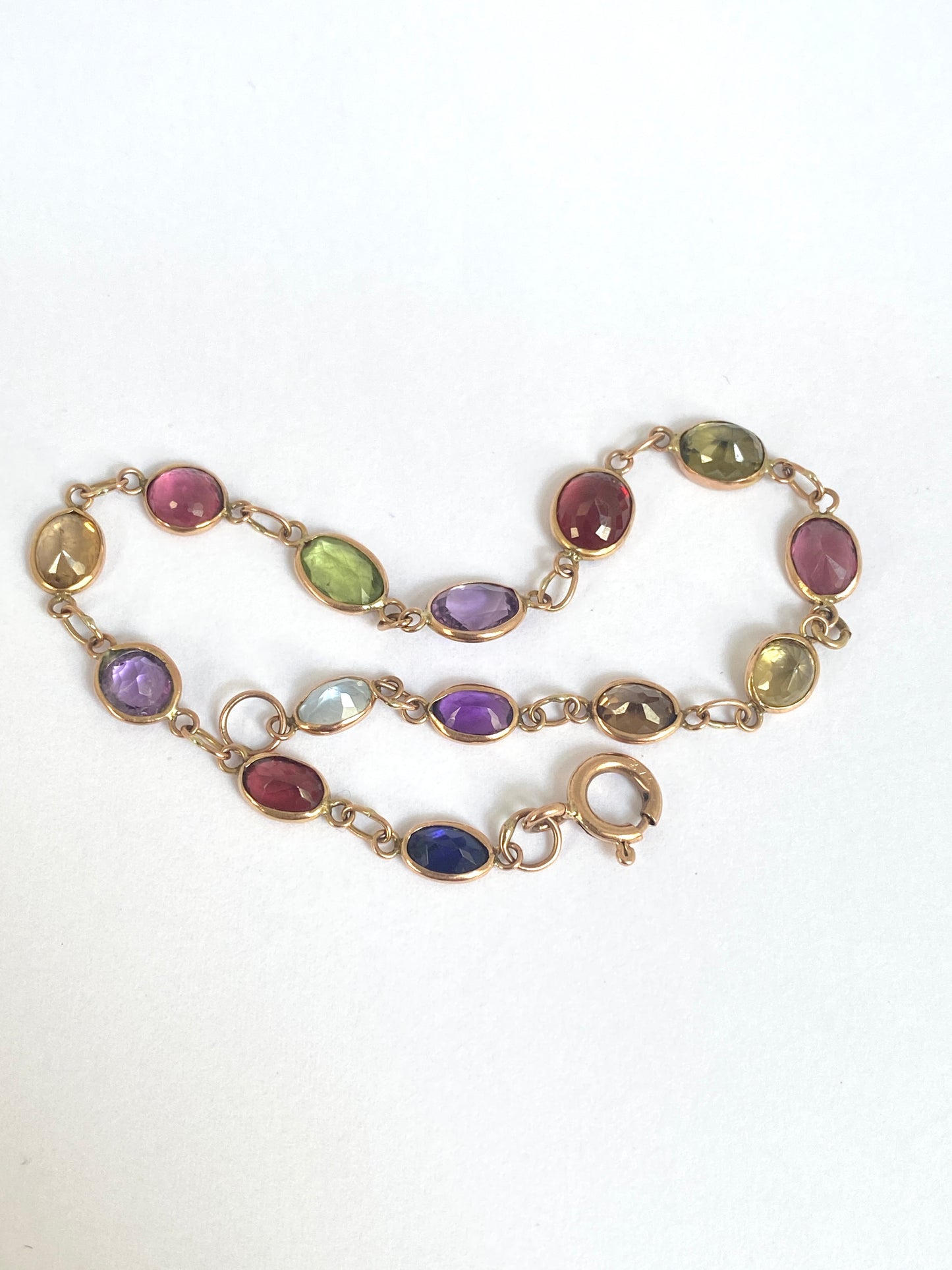 Vintage, 9ct Gold, Multi Gem Bracelet featuring, Peridot, Garnet, Amethyst, and Zircon