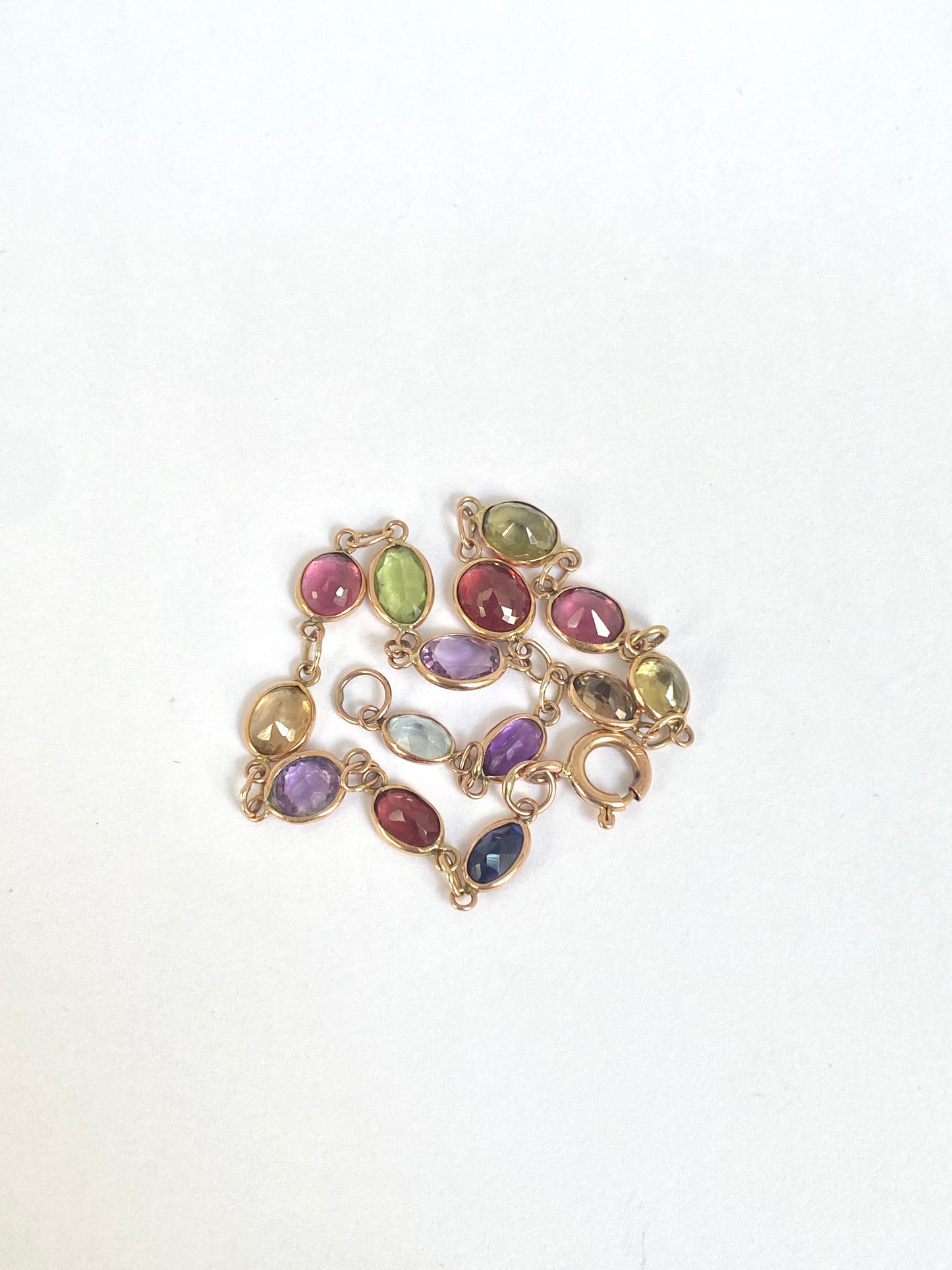 Vintage, 9ct Gold, Multi Gem Bracelet featuring, Peridot, Garnet, Amethyst, and Zircon