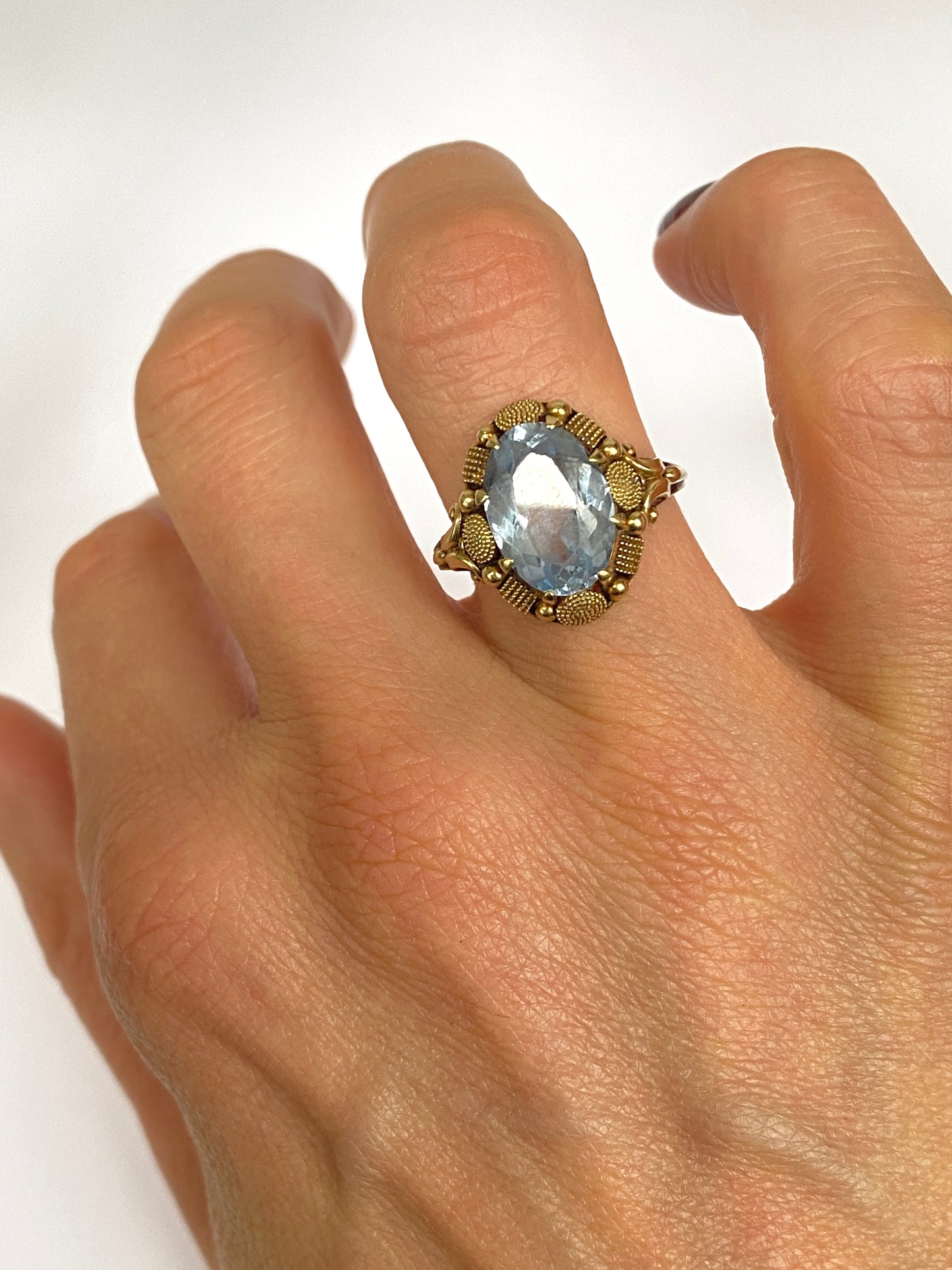 Continental, 14ct Gold Blue Topaz Ring with incredible border
