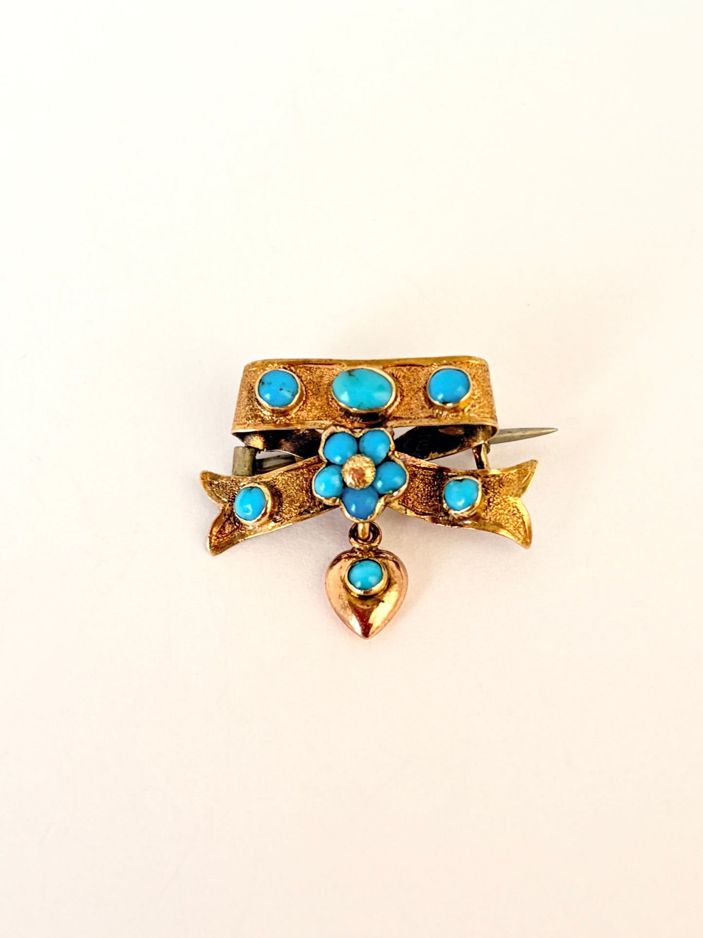 Victorian, 15ct Gold Turquoise Bow with hanging heart