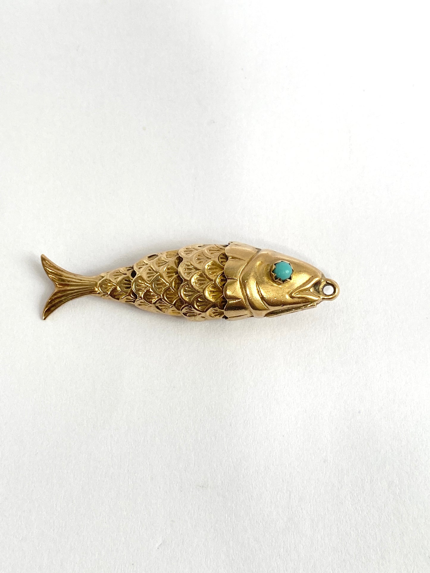 Vintage, 9ct Gold, articulated fish charm/pendant with turquoise eyes