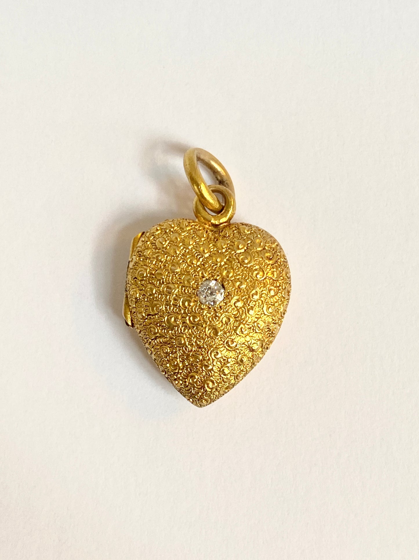 Antique, Victorian, 15ct Gold, Heart-shaped chased locket/pendant, with central old cut diamond