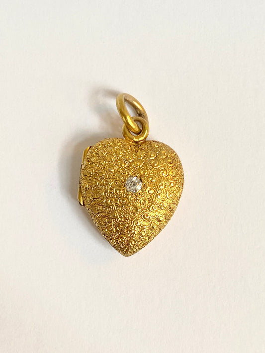 Antique, Victorian, 15ct Gold, Heart-shaped chased locket/pendant, with central old cut diamond